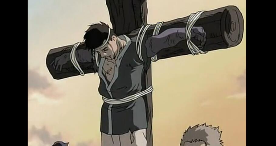 在回忆中我们看到伊那立的父亲被卡多陷害,绑在十字架上,而且双手被废