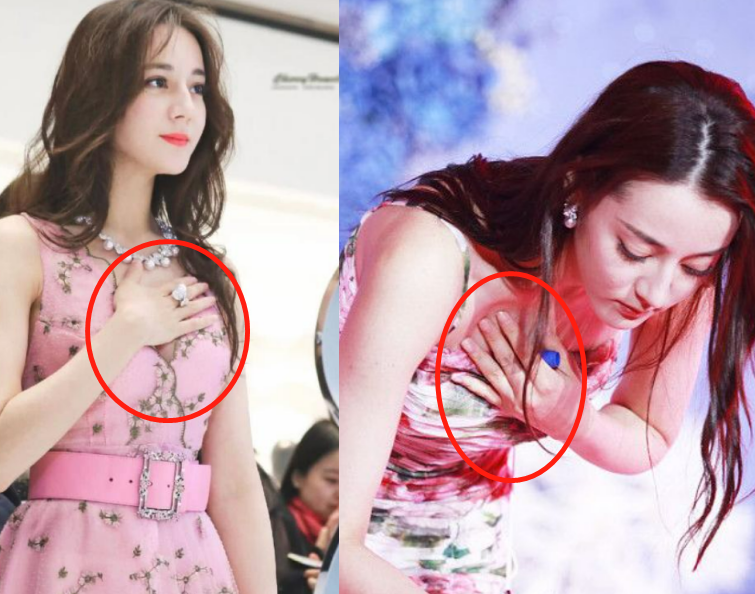 热巴穿镂空吊带裙参加活动!侧面开叉缝住一截,巴掌全程挡在领口