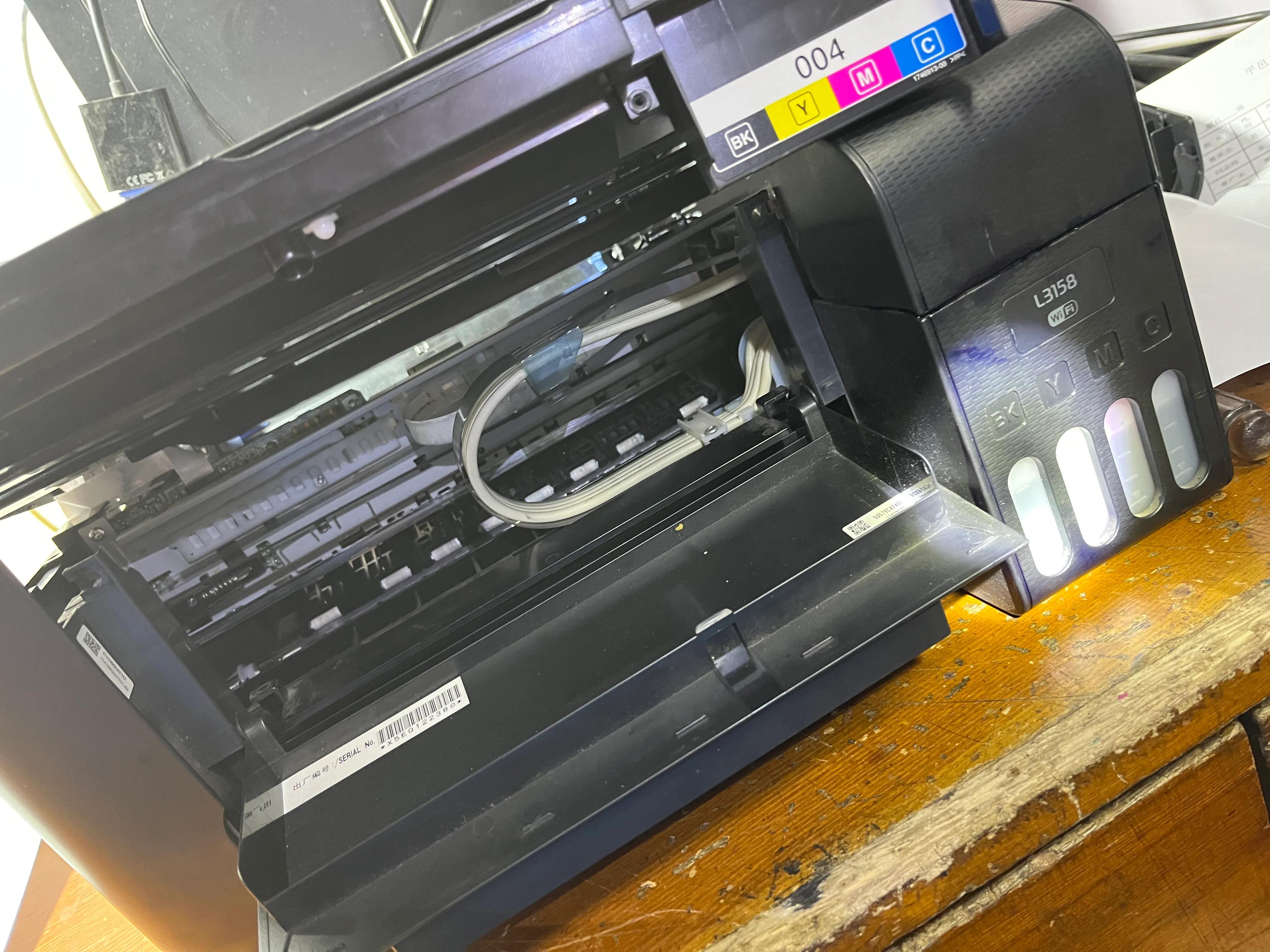 今天维修一台爱普生l3158缺纸灯闪不进纸,初步判断打印内部有卡纸或者