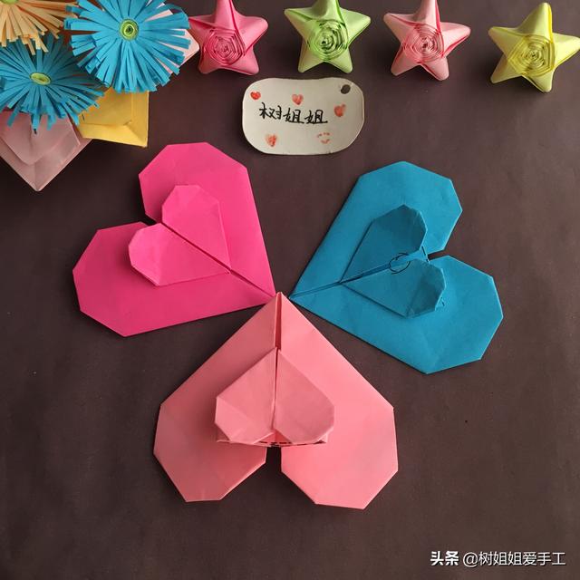 手工折爱心折法，手工折爱心教程（实用折纸：双爱心书签）