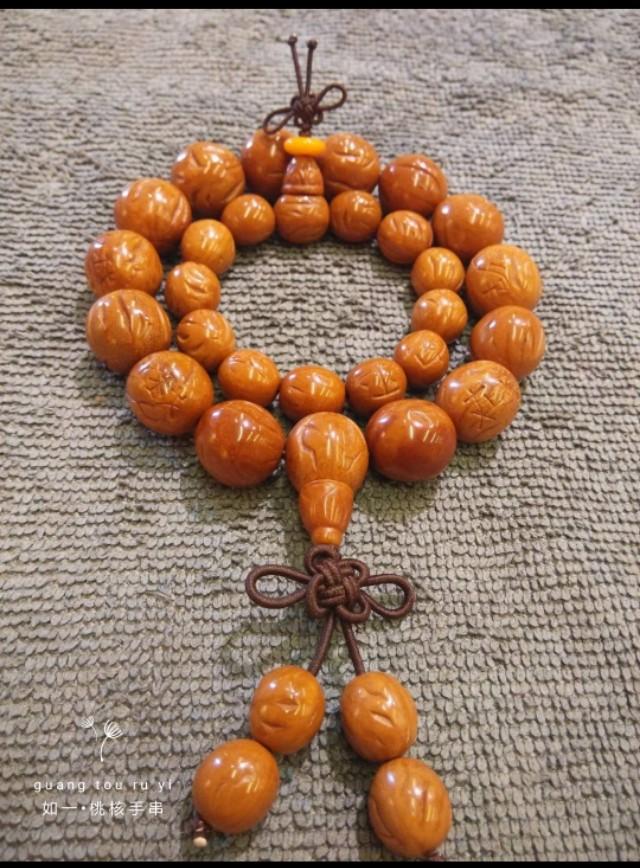 桃核是辟邪还是招鬼，桃子的桃核可以辟邪吗（我的文玩新宠——桃核手串）