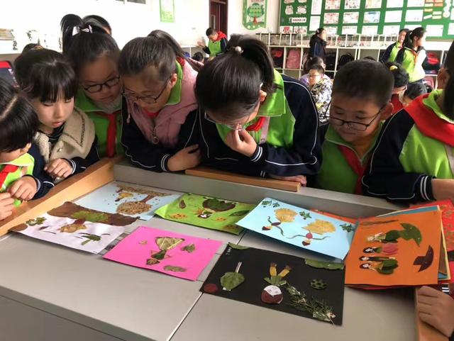 树叶贴画作品一等奖，树叶贴画作品一等奖桃花（留住秋天的味道——荣成市第二实验小学开展树叶粘贴画活动）