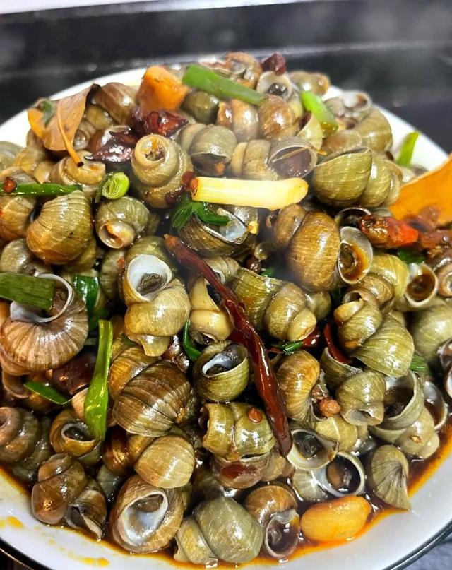 田螺肉如何处理才好吃，田螺肉怎么处理最干净（吃田螺有什么好处吗）