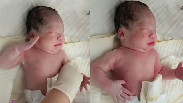 ​宝宝被夸敬礼，刚出生宝宝被夸一脸正气后抬手敬礼